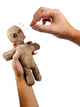 hands holding creepy voodoo doll with needles isolated on white Wall Decal