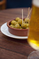 Spain, Majorca, Beer and olives in cafe Wall Mural
