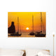 Spain, Yachts and strange shaped rock off Benirras beach at dusk Wall Mural