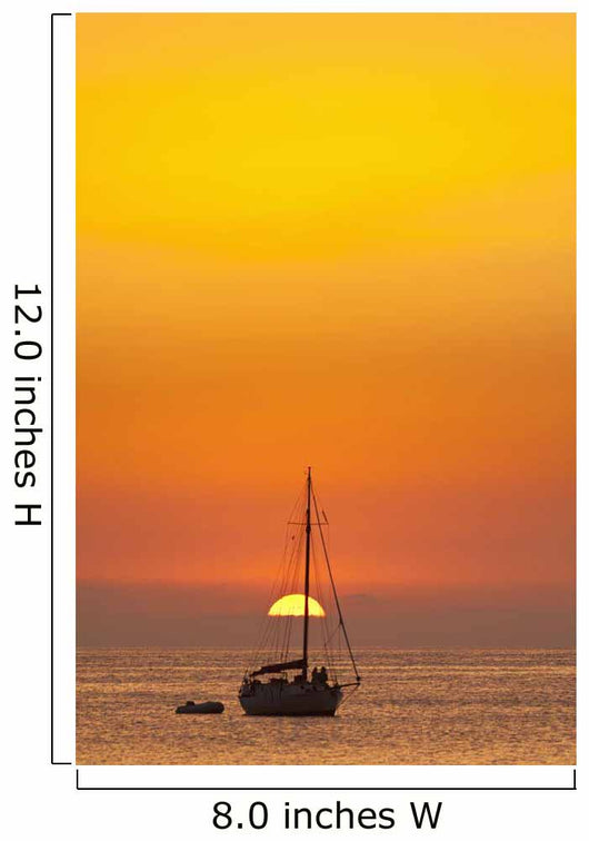 Spain, People watching sunset from yacht moored off Benirras beach Wall Mural