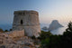 Spain, Torre des Savinar and Es Vedra island at sunset Wall Mural