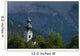 Germany, Stormy clouds behind Ruhpolding church Wall Mural
