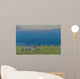 Zebras on grassy hill Wall Mural