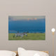 Zebras on grassy hill Wall Mural