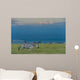 Zebras on grassy hill Wall Mural