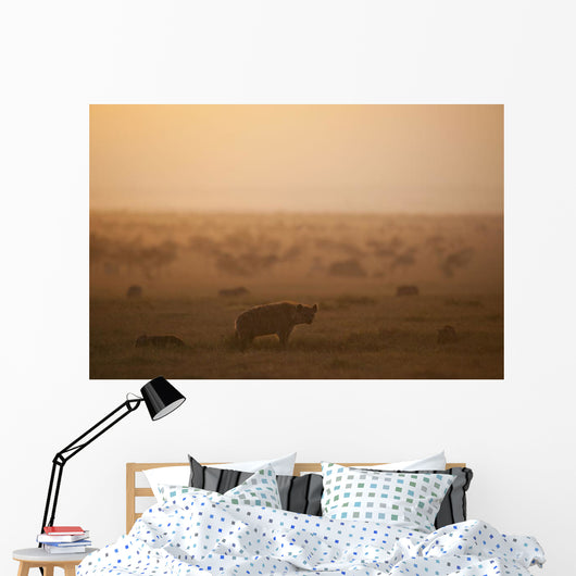 Kenya, Hyena with cubs at dawn in Ol Pejeta Conservancy Wall Mural