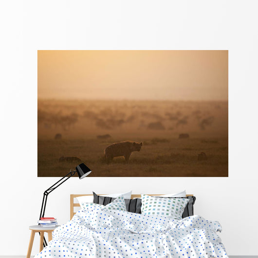 Kenya, Hyena with cubs at dawn in Ol Pejeta Conservancy Wall Mural