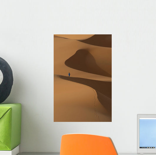 Berber 'Blue man' walking across sand dunes in Erg Chebbi area Wall Mural