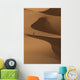 Berber 'Blue man' walking across sand dunes in Erg Chebbi area Wall Mural