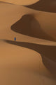 Berber 'Blue man' walking across sand dunes in Erg Chebbi area Wall Mural