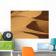 Berber 'blue man' walking through sand dunes in Erg Chebbi area Wall Mural
