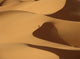 Berber 'blue man' walking through sand dunes in Erg Chebbi area Wall Mural