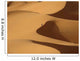 Berber 'blue man' walking through sand dunes in Erg Chebbi area Wall Mural