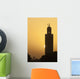 Morocco, Sun setting behind minaret of Koutoubia mosque Wall Mural