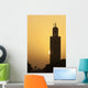 Morocco, Sun setting behind minaret of Koutoubia mosque Wall Mural