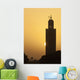 Morocco, Sun setting behind minaret of Koutoubia mosque Wall Mural