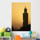 Morocco, Sun setting behind minaret of Koutoubia mosque Wall Mural