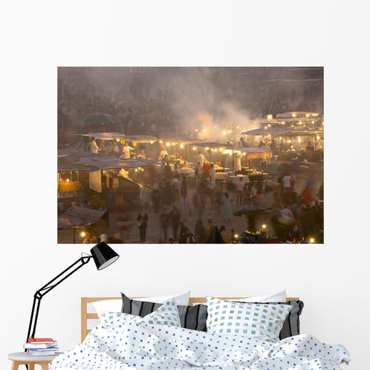 Morocco, People and food stalls in Place Djemaa el Fna at dusk Wall Mural
