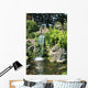 Waterfall and Koi pond in an Asian garden Wall Mural