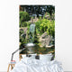 Waterfall and Koi pond in an Asian garden Wall Mural