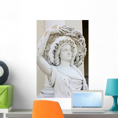 Ancient Art Marble Statue shown on a wall
