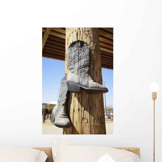 Cowboy Boots Hanging From A Post At A Riding Ranch;Arizona Usa Wall Mural