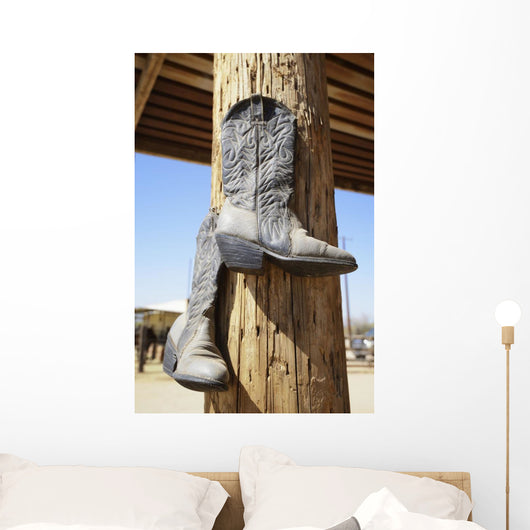 Cowboy Boots Hanging From A Post At A Riding Ranch;Arizona Usa Wall Mural