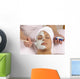 spa esthetician applying organic facial masque Wall Mural