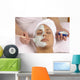 spa esthetician applying organic facial masque Wall Mural