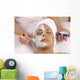 spa esthetician applying organic facial masque Wall Mural