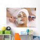 spa esthetician applying organic facial masque Wall Mural