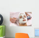 spa esthetician applying facial masque Wall Mural