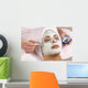 spa esthetician applying facial masque Wall Mural