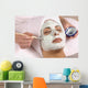 spa esthetician applying facial masque Wall Mural