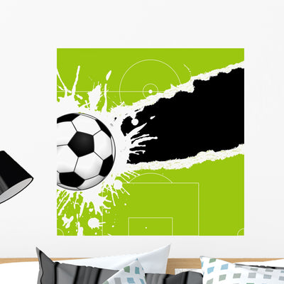Soccer Ball Torn Paper Wall Mural shown on a wall