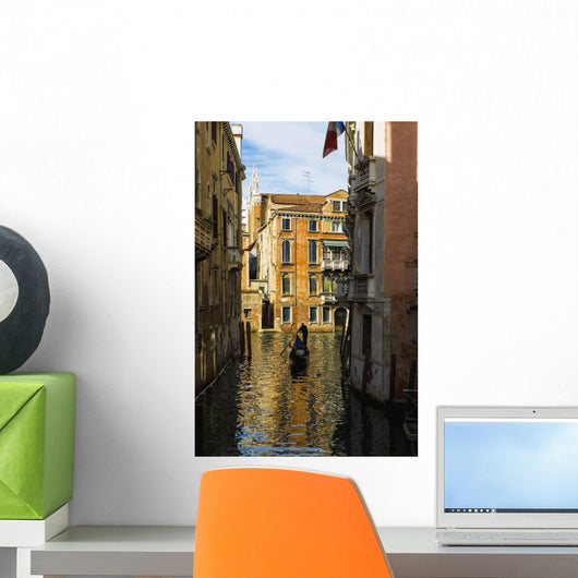 Italy, Venice, Rowing gondola through canal Wall Mural