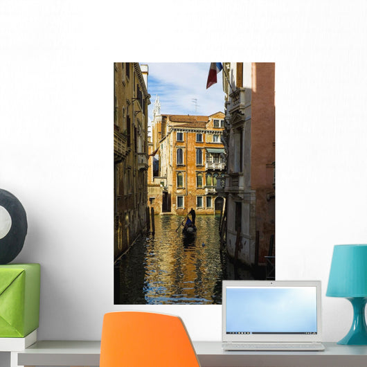 Italy, Venice, Rowing gondola through canal Wall Mural