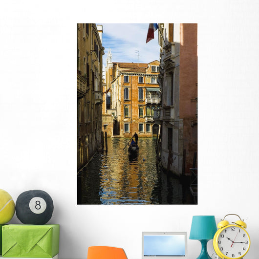 Italy, Venice, Rowing gondola through canal Wall Mural