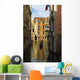 Italy, Venice, Rowing gondola through canal Wall Mural