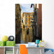 Italy, Venice, Rowing gondola through canal Wall Mural