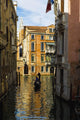 Italy, Venice, Rowing gondola through canal Wall Mural