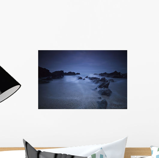 Long exposure of rocks on the beach at night;Newquay cornwall england Wall Mural