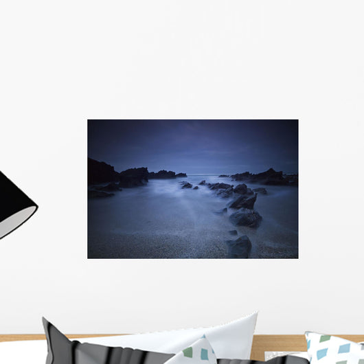 Long exposure of rocks on the beach at night;Newquay cornwall england Wall Mural