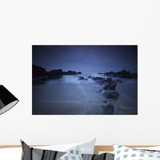 Long exposure of rocks on the beach at night;Newquay cornwall england Wall Mural