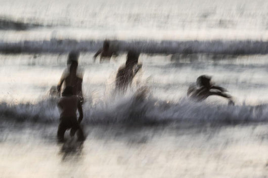 India, Karnataka, Blurry Figures In Crashing Waves At Gokarna Beach Wall Mural