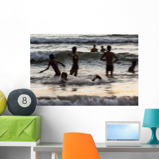 India, Karnataka, Blurry Figures In Crashing Waves At Gokarna Beach Wall Mural