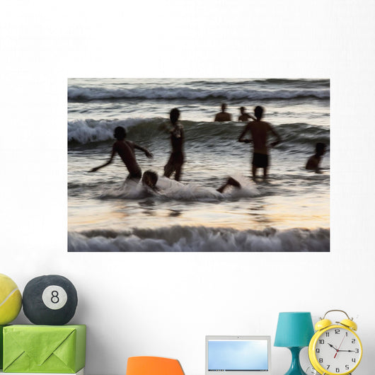India, Karnataka, Blurry Figures In Crashing Waves At Gokarna Beach Wall Mural