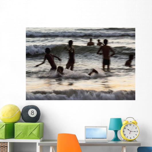 India, Karnataka, Blurry Figures In Crashing Waves At Gokarna Beach Wall Mural