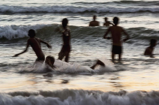 India, Karnataka, Blurry Figures In Crashing Waves At Gokarna Beach Wall Mural