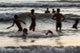 India, Karnataka, Blurry Figures In Crashing Waves At Gokarna Beach Wall Mural